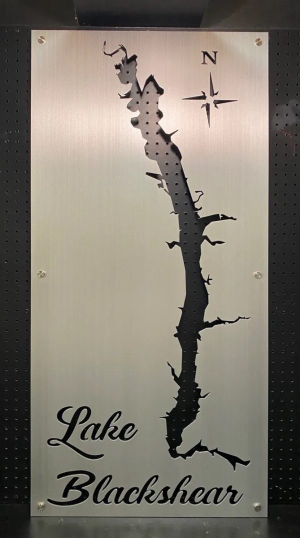 Custom metal sign of Lake Blackshear silhouette with compass rose on a perforated background.