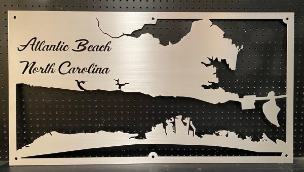 Metal sign featuring a map of Atlantic Beach, North Carolina, with elegant script on a perforated background.