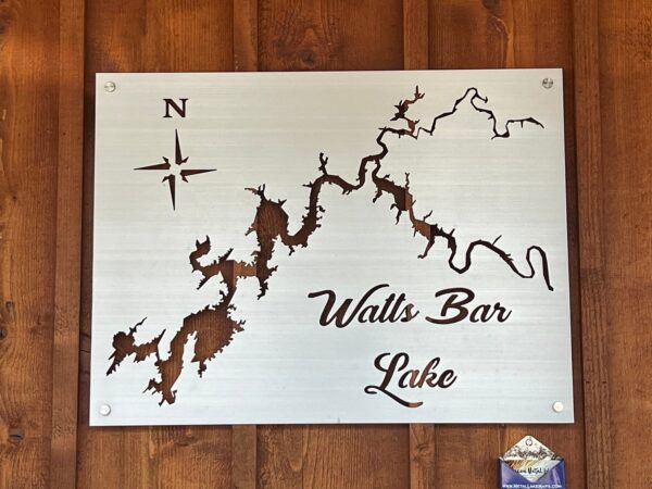 Watts Bar Lake metal map with compass rose on brushed silver, mounted on a wooden wall.