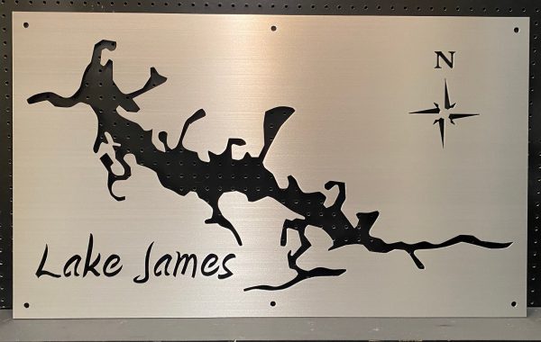 Lake James map sign with intricate lake outline and compass rose on brushed metal.