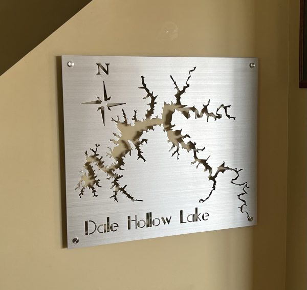 Metal map of Dale Hollow Lake with compass design on a brushed background, mounted on a wall.