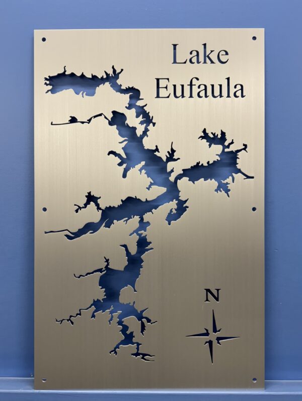 Brushed Aluminum Lake Eufaula Map with compass rose on a blue wall.