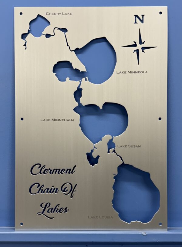 Clermont chain of lakes map on a brushed-metal plaque with labeled cutouts of Cherry, Minneola, Minnehaha, Susan, and Louisa.